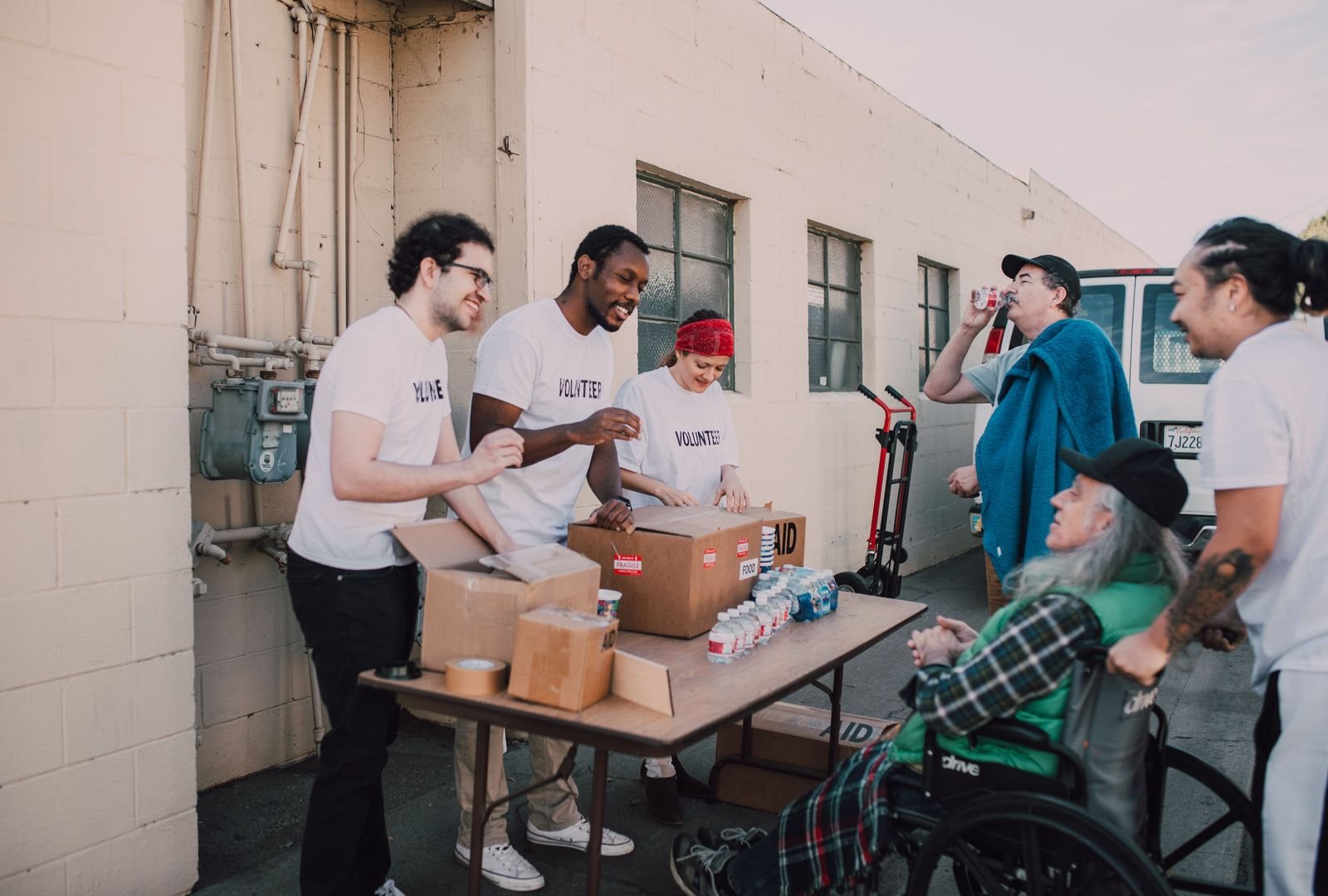 Corporate volunteers coordinating supplies during a community support event