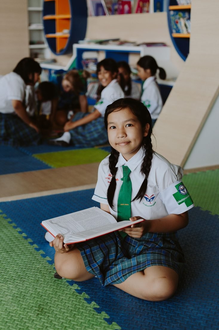 Children engaged in a joyful community learning activity