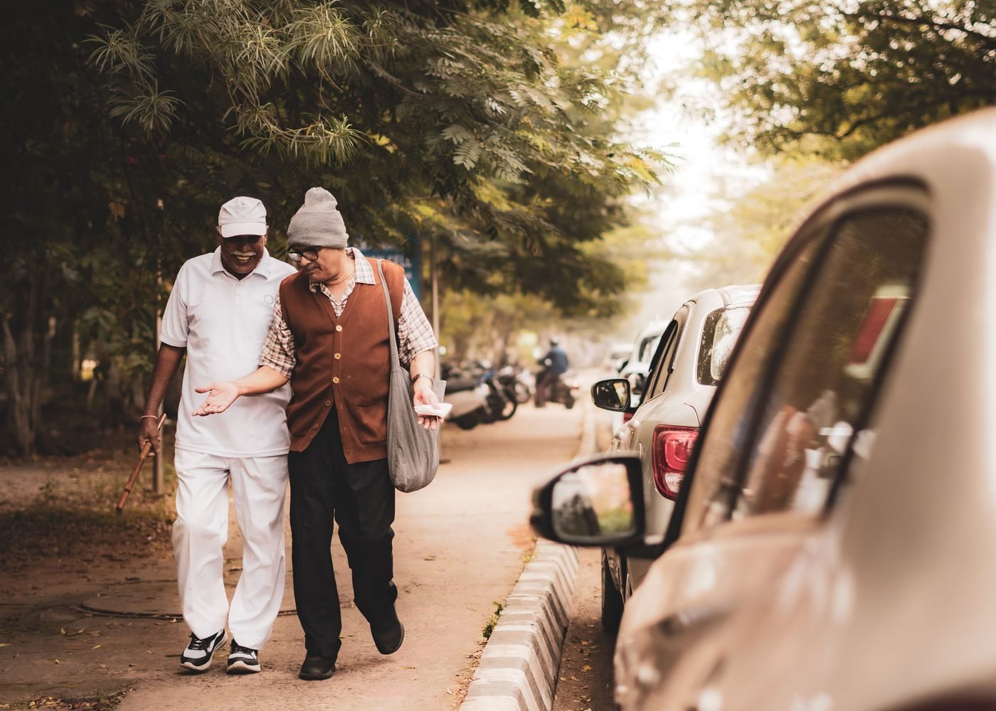 NGO volunteer listening to and supporting an elderly woman in a community setting