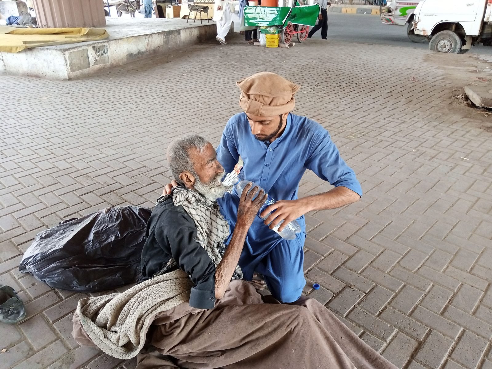 Volunteer spending time with senior citizens during an NGO community support programme
