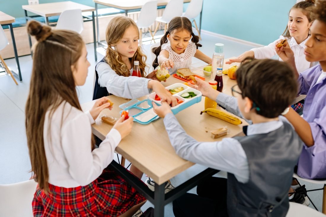 Children sharing a healthy meal together at school